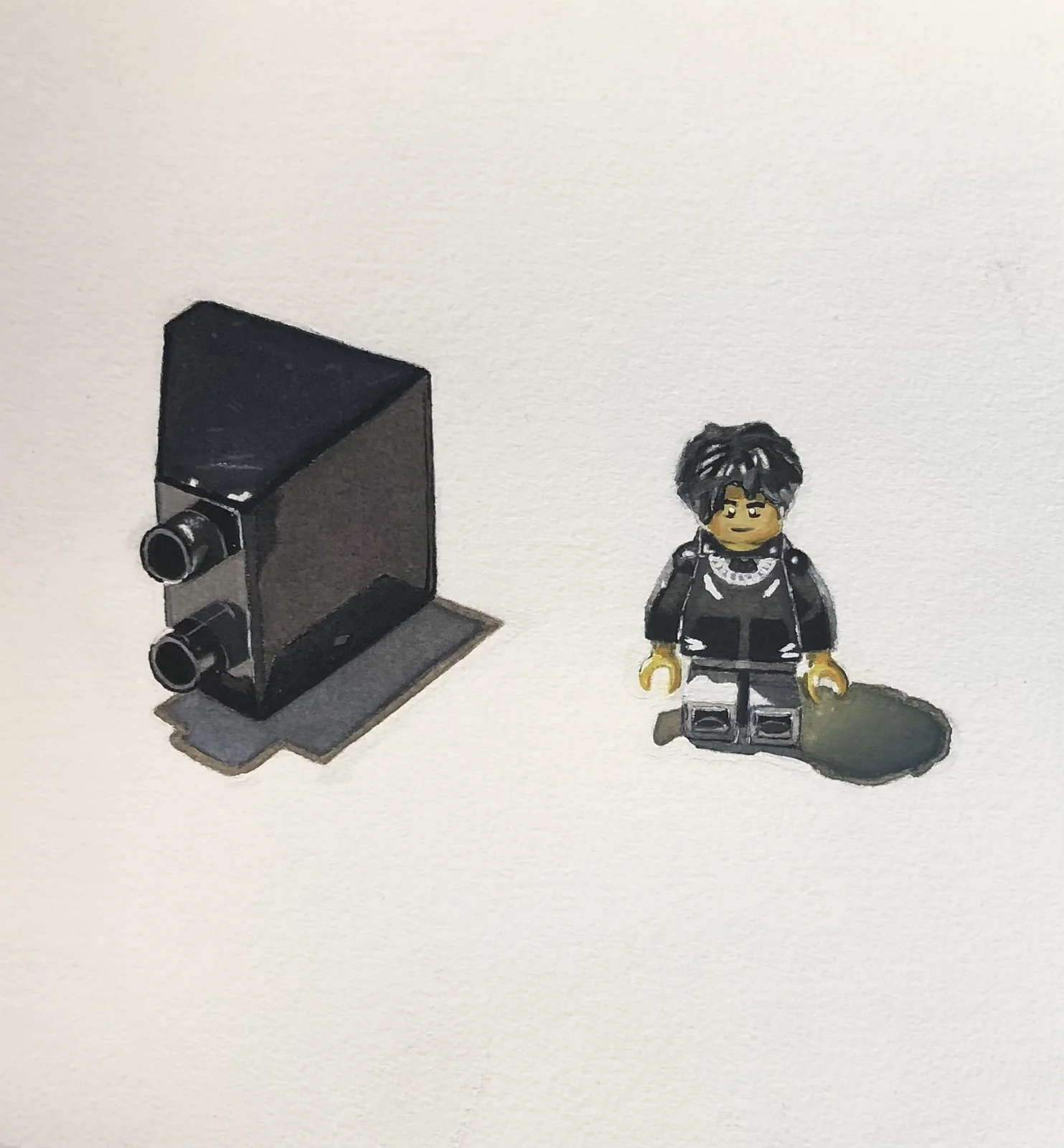 Still life of a camera and a LEGO figure