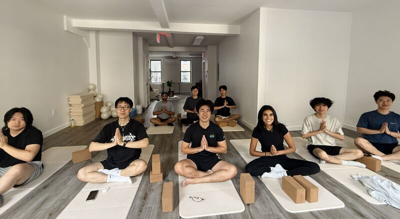 the melius team doing yoga in the morning