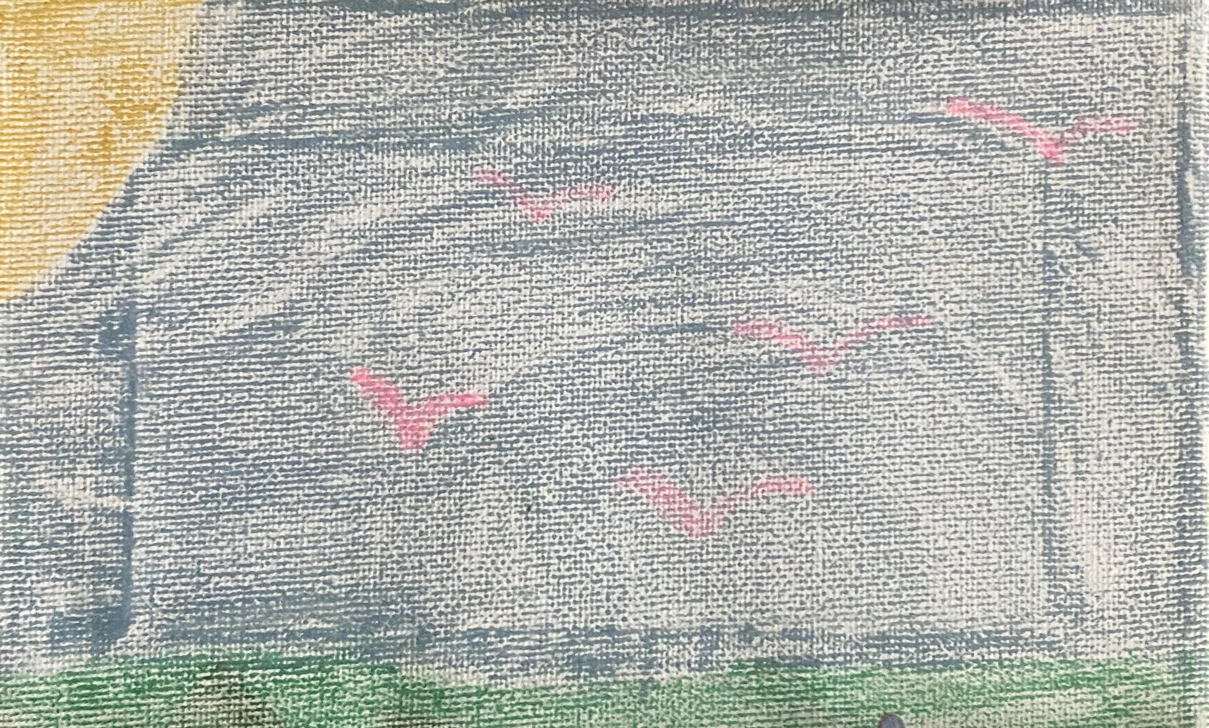Close-up of a textured gray surface with red and green markings